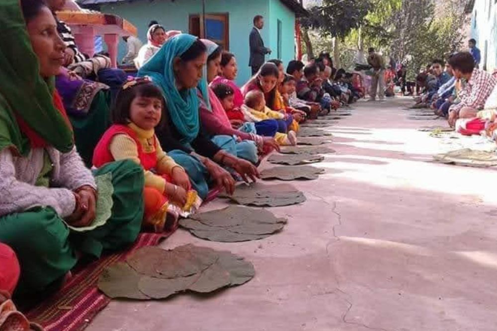 People Sitiing in Traditional Way to Eat Kangri Dham