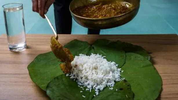 Rice searved on natural leaf in Dham