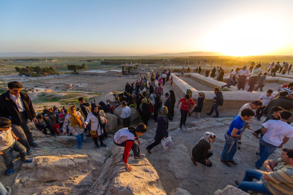 Iranian toursists exploring the ruins of Persepolis