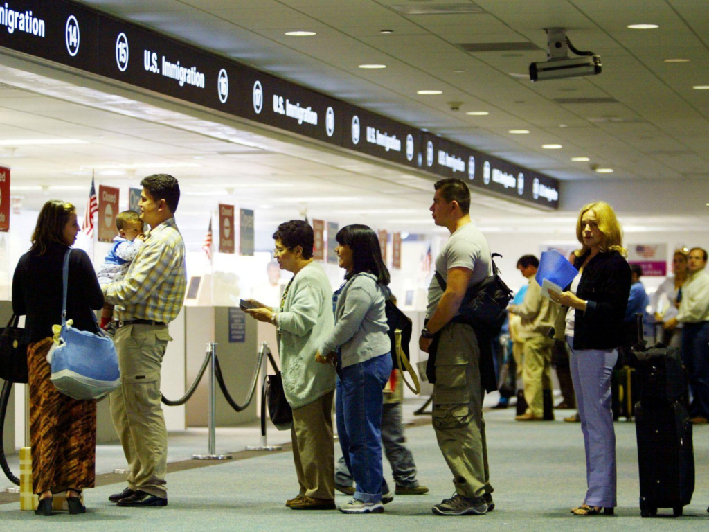 Travelers at US airport immigration for FIFA World Cup travel