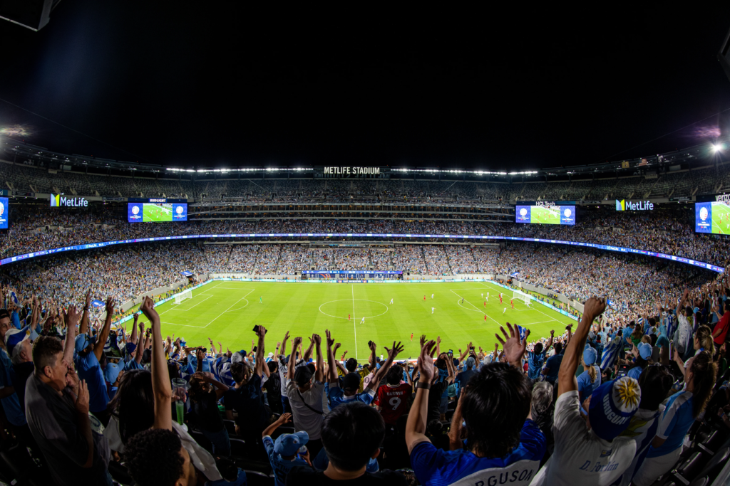 Packed FIFA World Cup stadium at night during match day