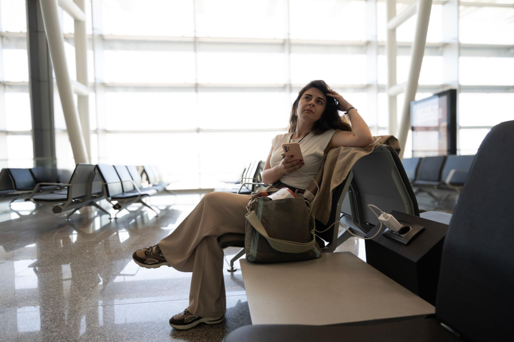 Solo woman traveler arriving late at night with luggage