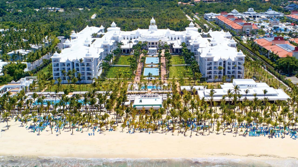 Luxury all-inclusive Caribbean resort overlooking turquoise water and white-sand beach in Punta Cana