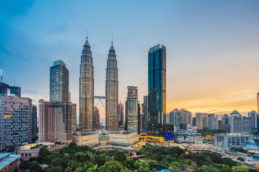 Aerial view of Kuala Lumpur Skyline with Petronas Towers at sunset