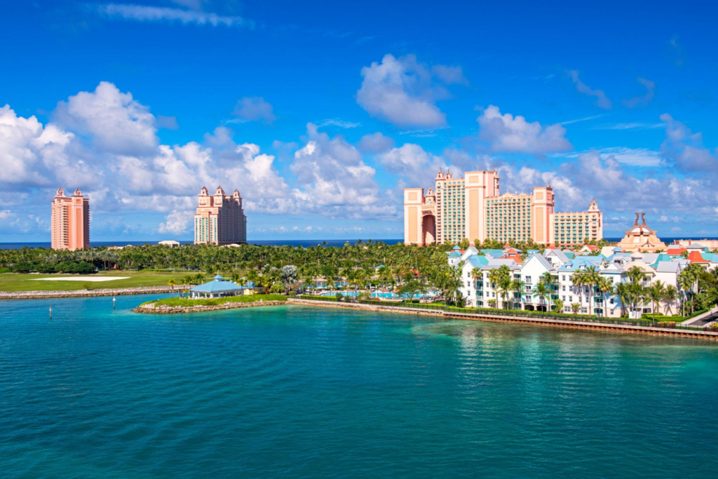 Large pink resort towers and colorful waterfront buildings on Paradise Island in the Bahamas